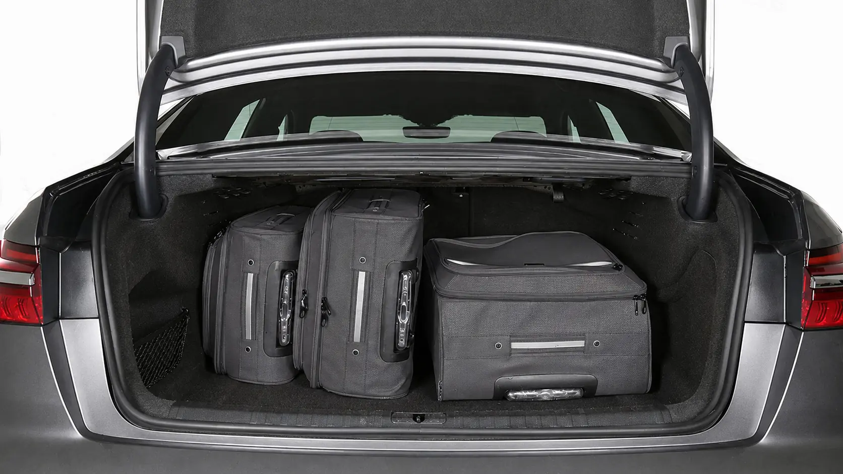 Audi A6L luggage compartment with dark grey luggage